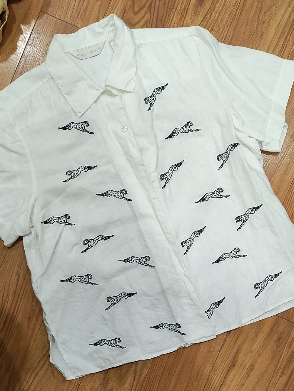 Women’s White Short-Sleeve Button-Down Shirt with Black Cheetah Motif